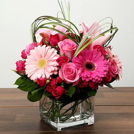 Roses & Gerbera Arrangement In Glass Vase: Gifts for New Born