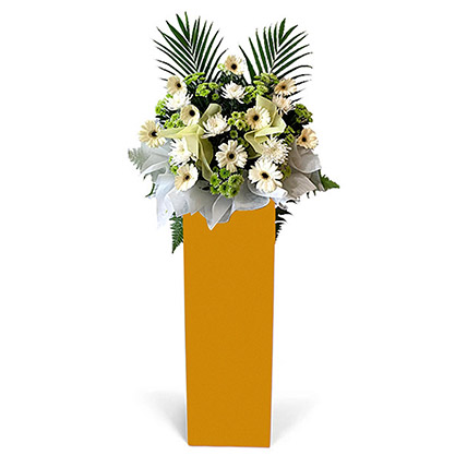 Alluring Mixed Flowers Arrangement In Brown Stand: Condolence Flowers