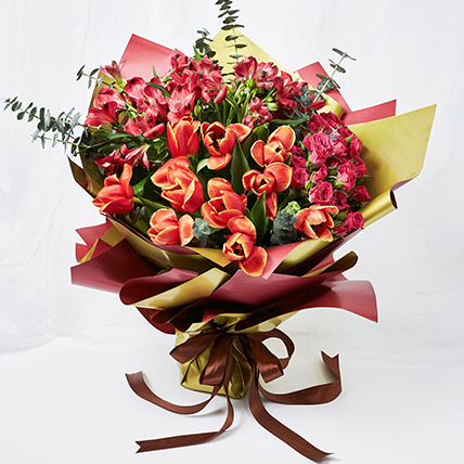 Lovely Mixed Flowers Wrapped Bouquet: Tulips Bouquet