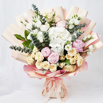 Ravishing Mixed Flowers Wrapped Bouquet: White Floral Bouquet