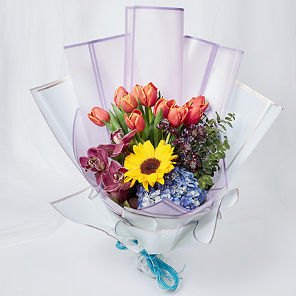 Vibrant Mixed Flowers Wrapped Bouquet: Gifts for Mom