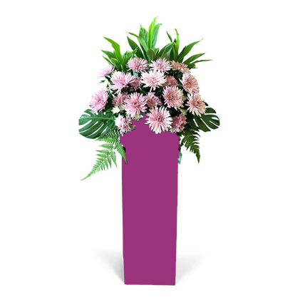 Elegant Pink Flowers Arrangement In Pink Stand