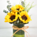 Lovely Sunflowers in Round Glass Vase