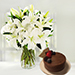 Serene Arranagement Of White Lilies With Chocolate Cake