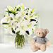 Serene Arranagement Of White Lilies With Teddy Bear