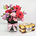 Lovely Mixed Flowers In Glass Vase With Ferrero Rocher