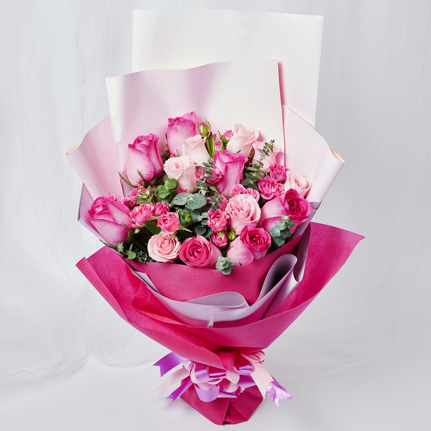 Online Magnificent Mixed Roses Wrapped Bouquet Gift Delivery in ...