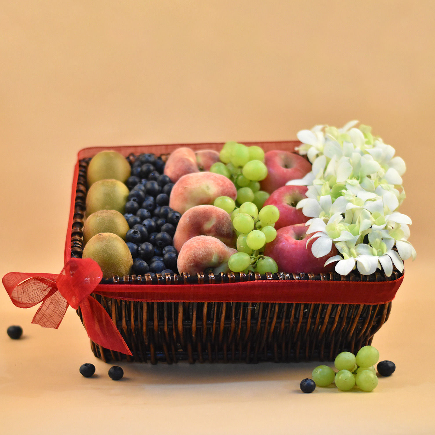 Online Dendrobium & Mixed Fruits Rectangular Basket Gift Delivery in