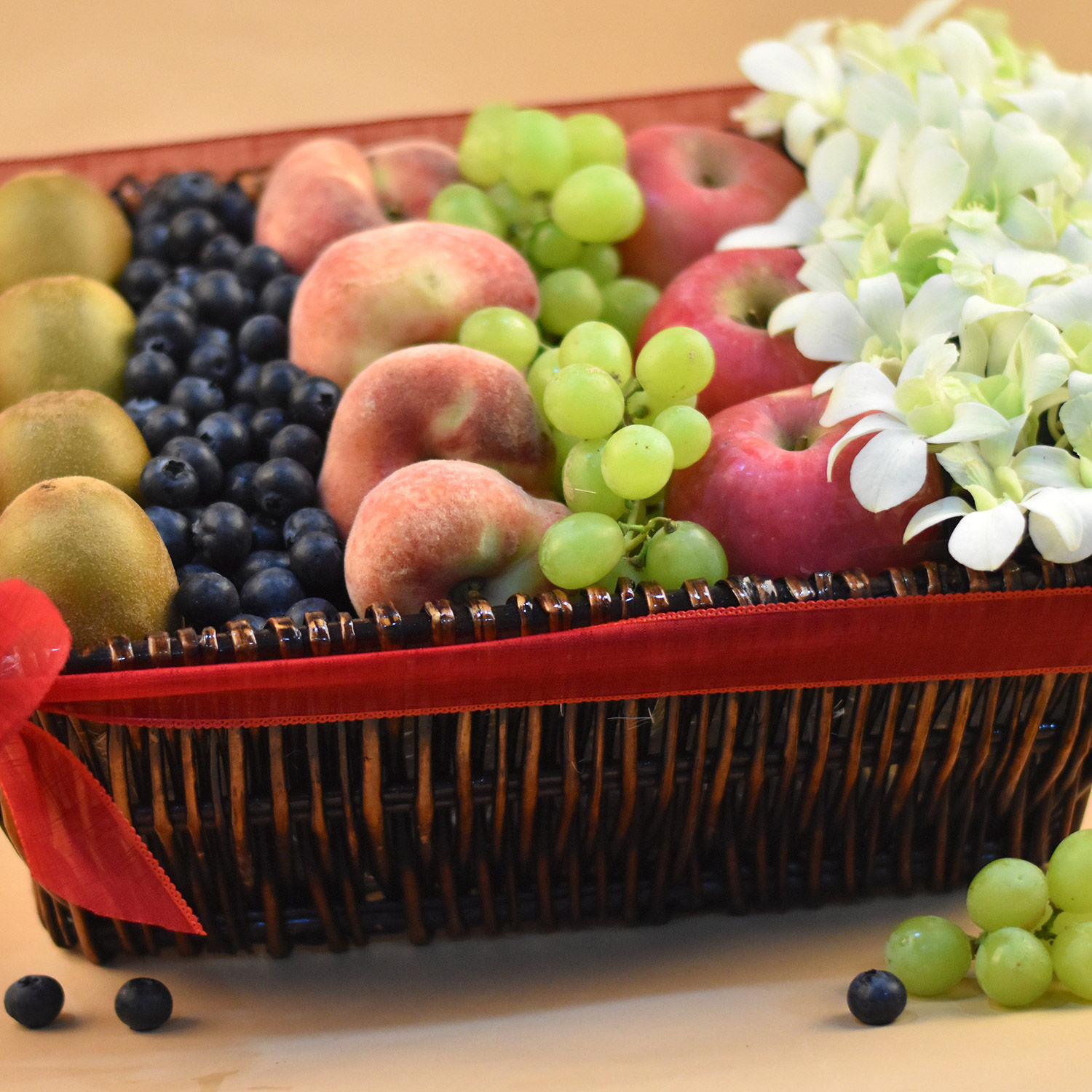 Online Dendrobium & Mixed Fruits Rectangular Basket Gift Delivery in